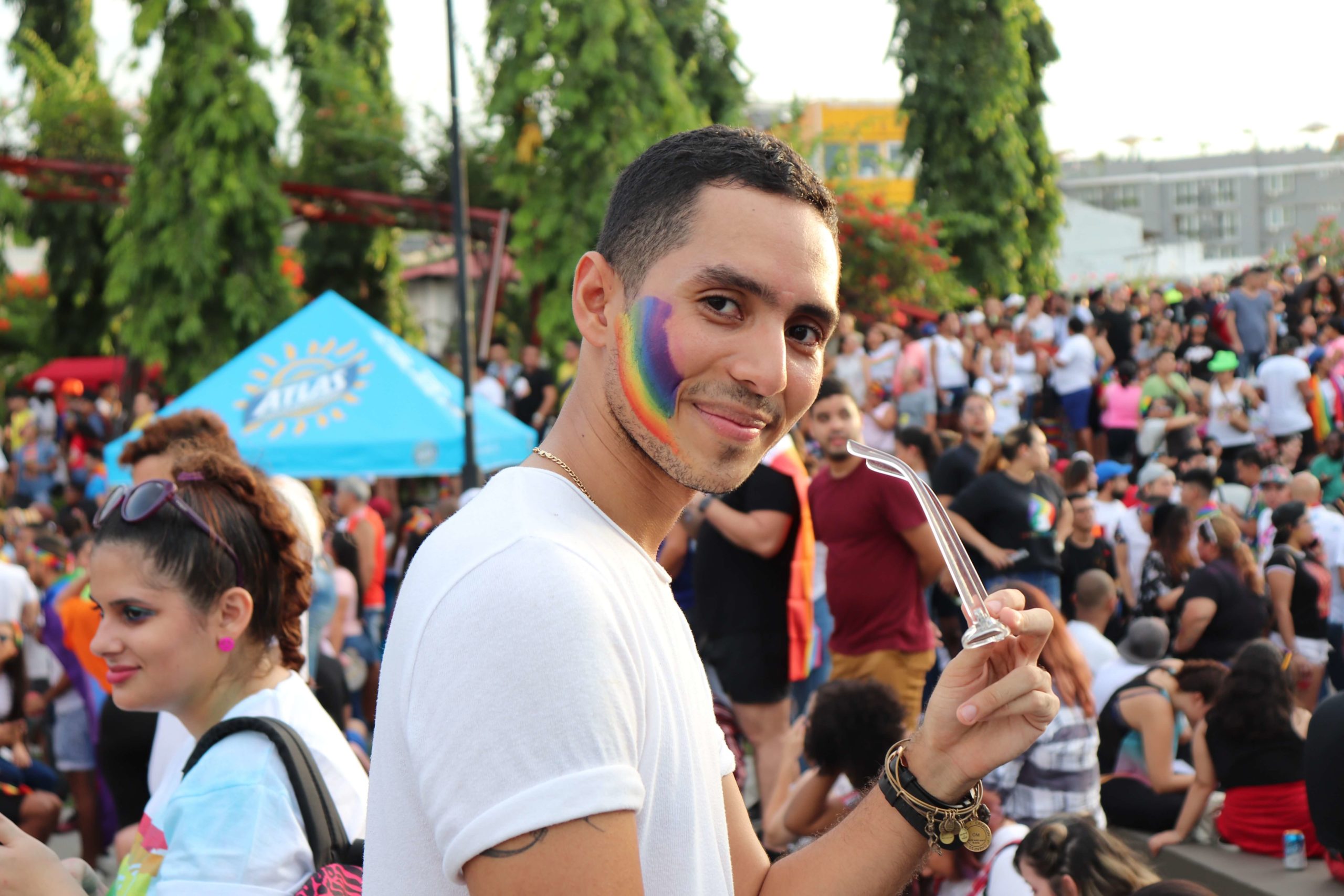 young person with rainbow temporary tattoo on their cheek