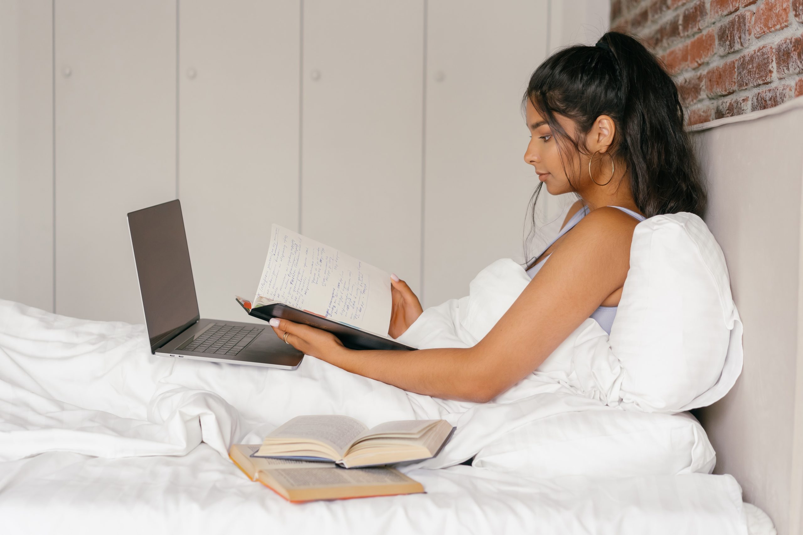 student studying in bed